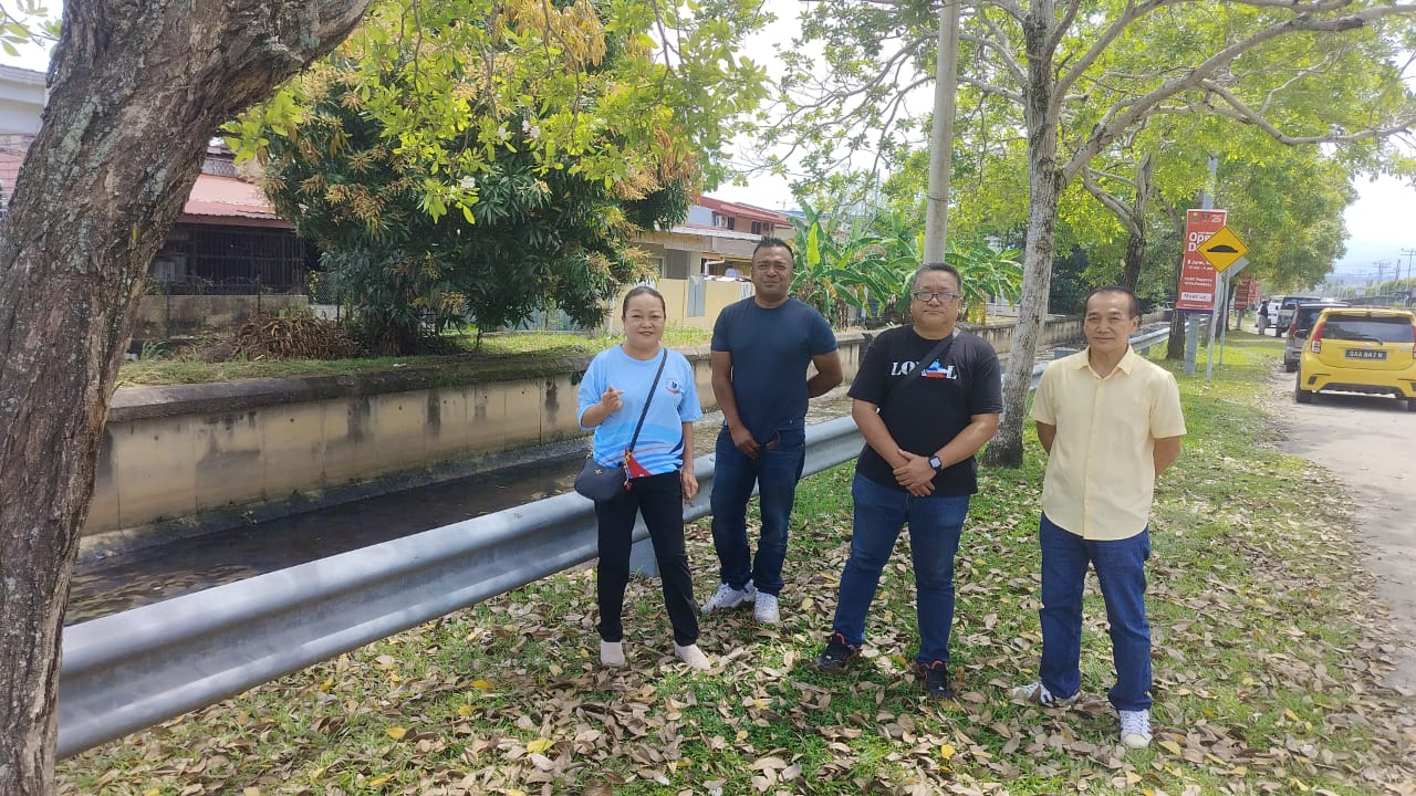 Junny (far left) during the inspection at KK High School